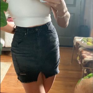Distressed black denim skirt
